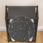 Close-up of the spacious multi-shelf shoe organizer’s water-resistant surface with droplets beading on top.