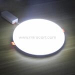 Close-up of sleek LED ceiling downlight with frameless, seamless design.