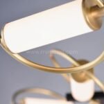 Opal acrylic tube with soft gold ring detail on Modern Cross Pendant Chandelier.